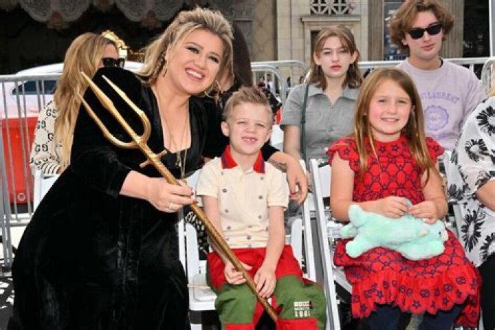 Kelly Clarkson Cuddles Up To Her Kids River, 7, & Remington, 5, On Family Trip To Disney World — See Rare Pic