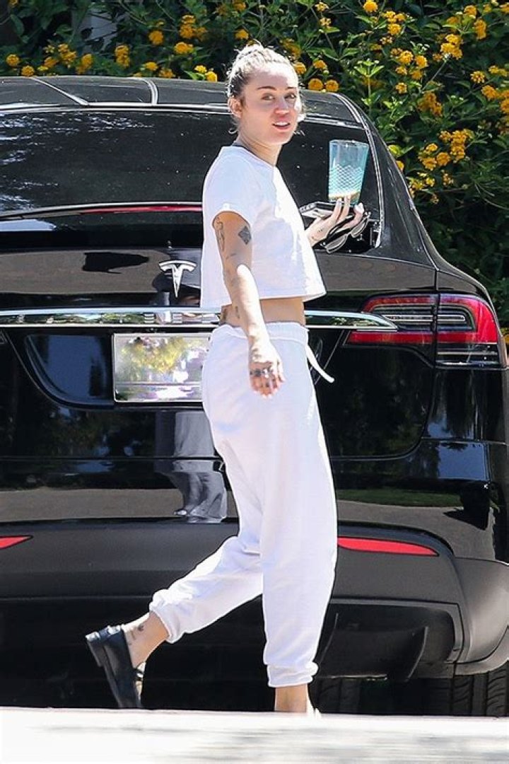 Miley Cyrus Rocks White Crop Top In New Video From Her ‘Pre-Game Turn Up’ Before Super Bowl