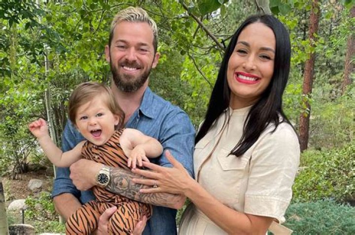 Nikki Bella Shares Adorable PDA Pics Of Artem Chigvintsev Cradling Her Baby Bump On Instagram